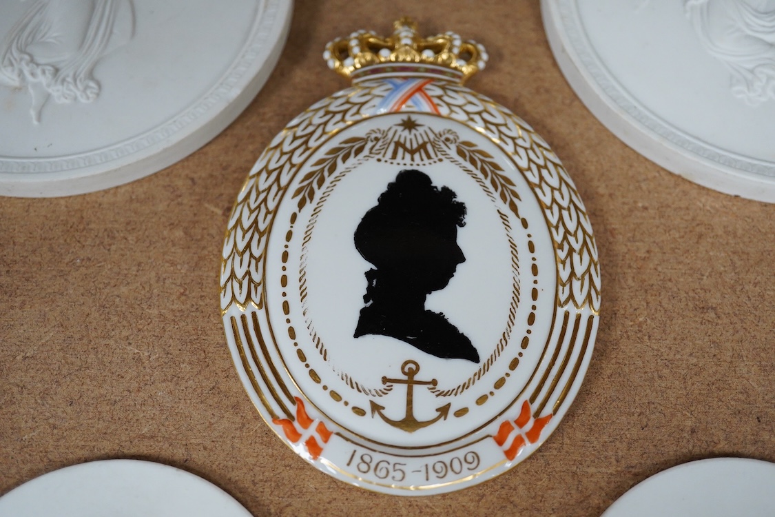 A pair of Copenhagen biscuit porcelain circular plaques, of Night and Day, two smaller French portrait plaques of Emperor Napoleon III and Empress Eugenie , and a Royal Copenhagen Princess Marie commemorative plaque, c.1